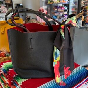 Elegant Black Tote Bag with Floral Scarf Accent